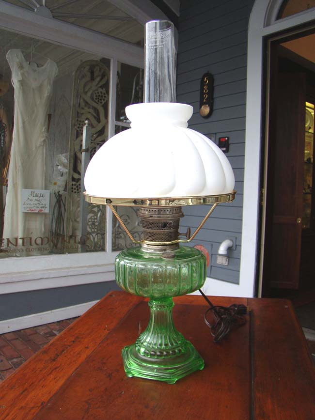 A wonderful late 19th century green glass oil lamp made by the Alladin Lamp Co., of Chicago circa 1885